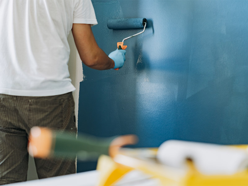 Services 15 adult painting interior wall blue with paint rolle 2026 01 08 22 15 08 utc