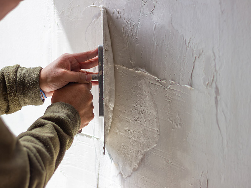 Services 21 spreading plaster on wall for renovation project 2026 03 20 04 11 07 utc